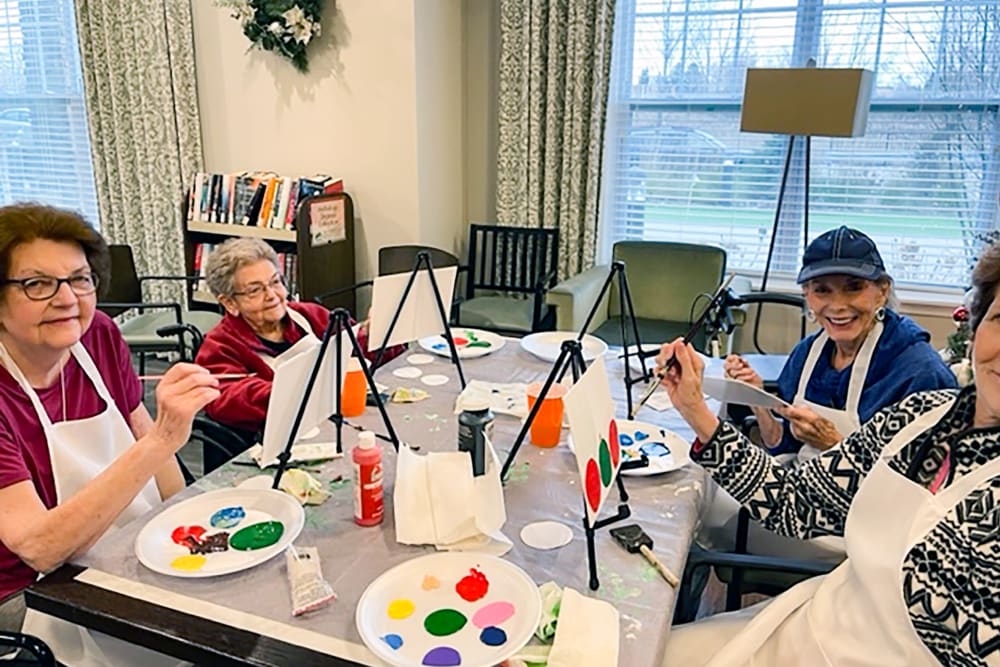 Group of residents painting at Anthology of Millis in Millis, Massachusetts