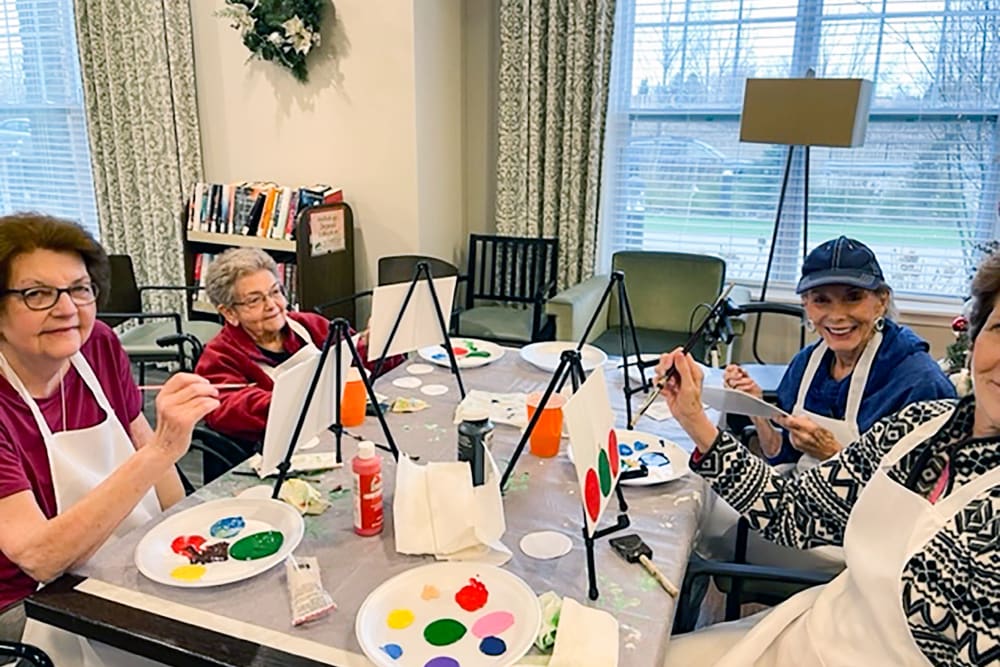 Residents participating in a painting activity at Anthology of Edmonds in Edmonds, Washington